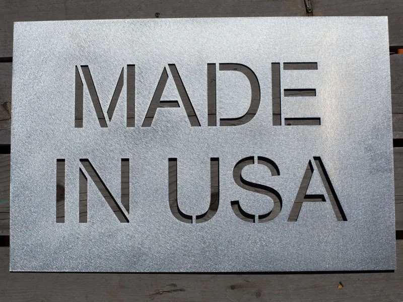 A close-up of a stainless steel PCB stencil.