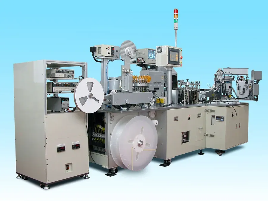 A production line making capacitors.