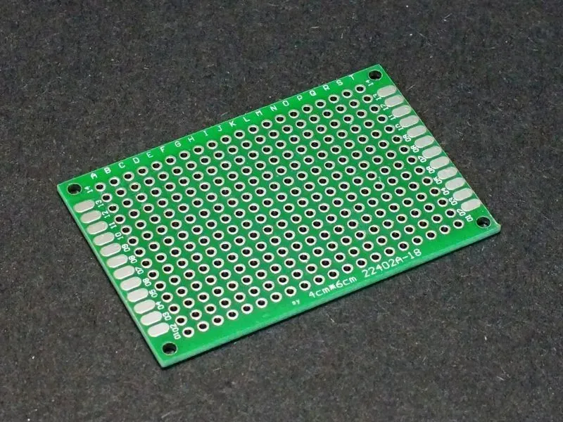 A PCB prototype board showing various components.