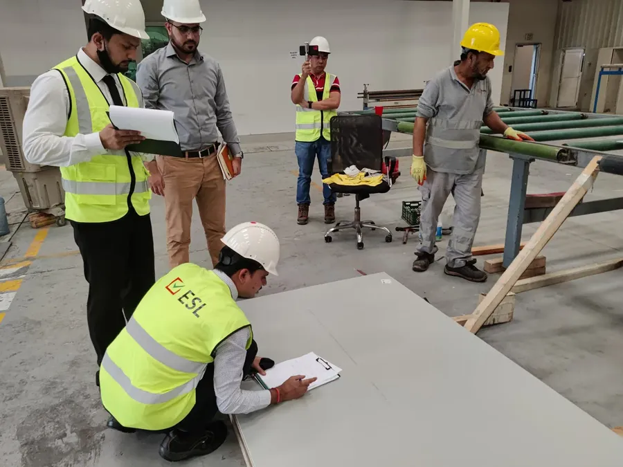 A person conducting an audit at an FPC manufacturing facility.