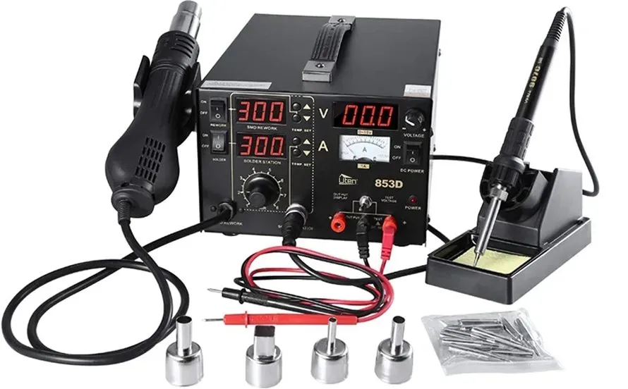 Soldering tools and equipment on a workbench for PCB repair.