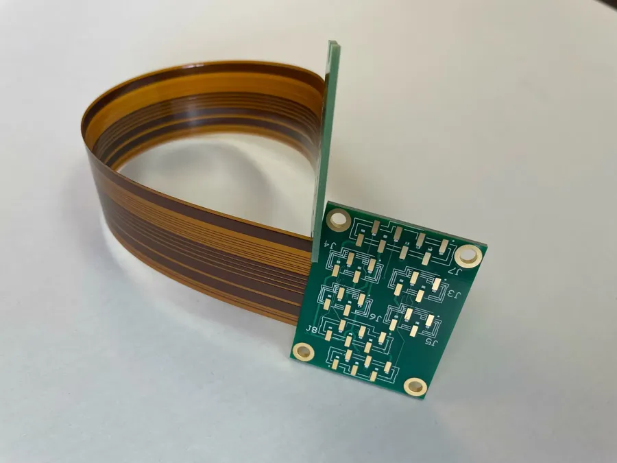 A close-up view of a flex rigid PCB with flexible and rigid sections.