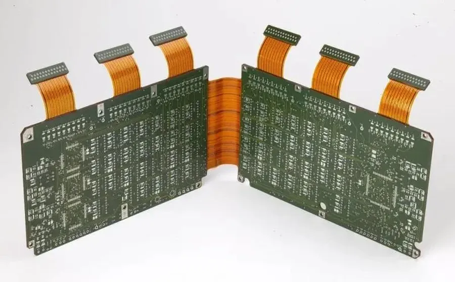 A close-up view of a rigid-flex PCB showing both rigid and flexible sections.