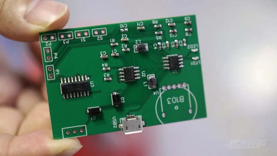 A PCB being inspected, highlighting the turnkey assembly process.