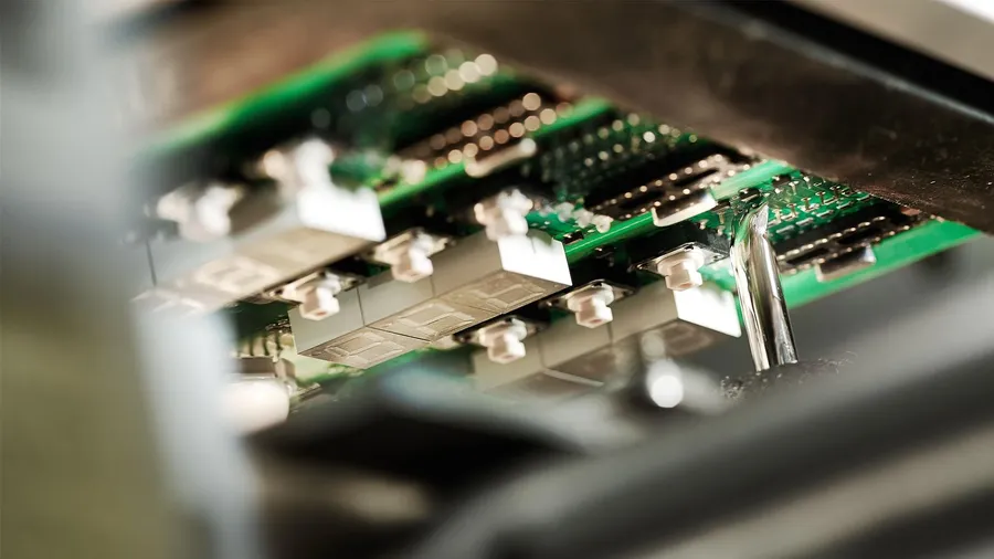 A large batch of PCBs being produced.
