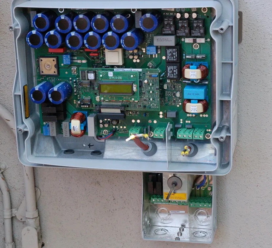 Internal view of an inverter showing PCB and other parts.