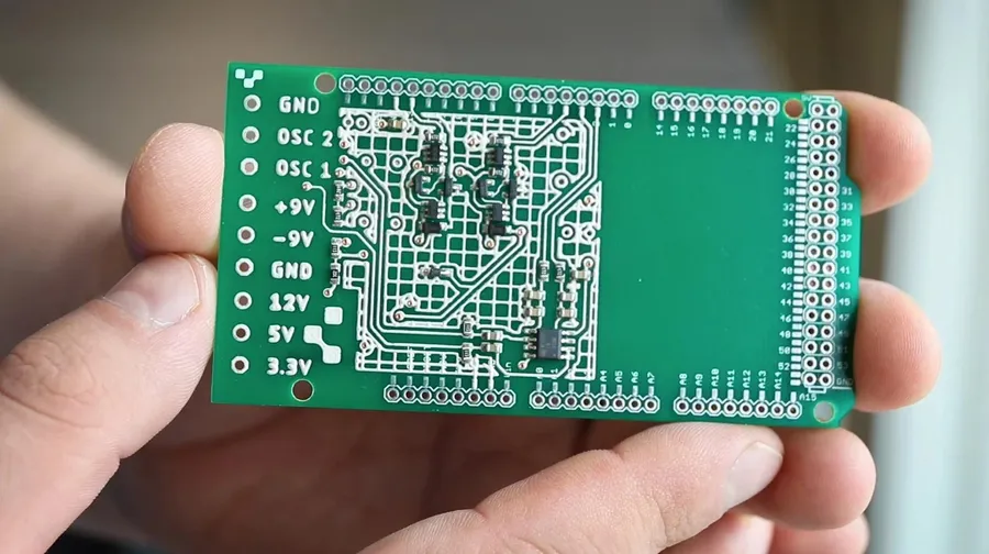 Close-up of a finished printed circuit board with components.