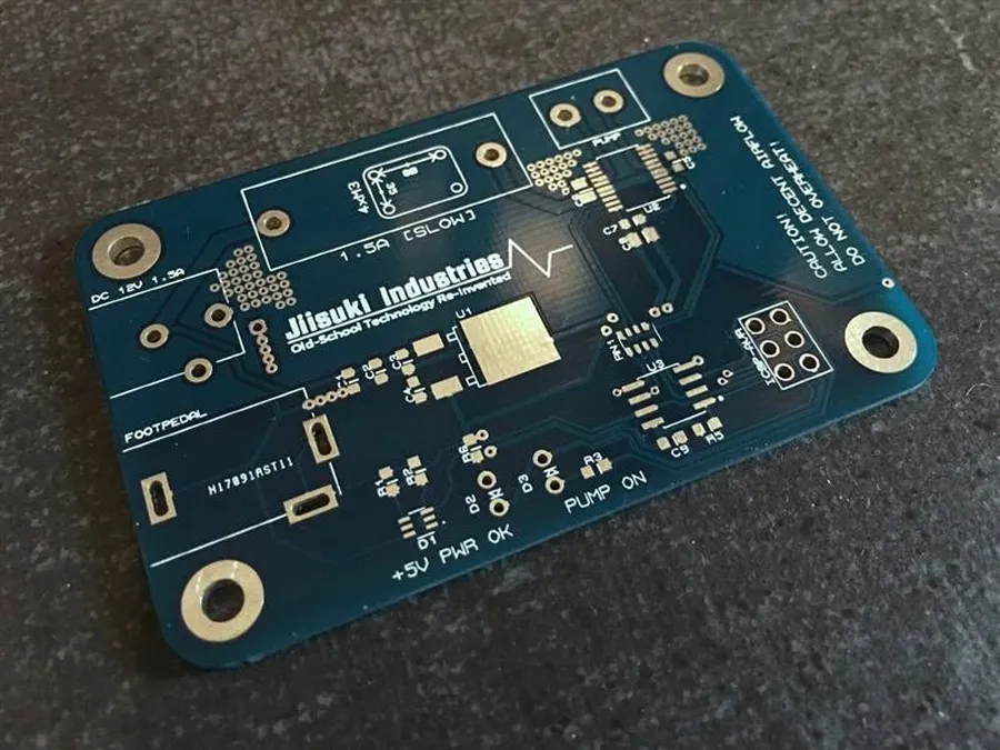 A person ordering PCBs online using a computer.