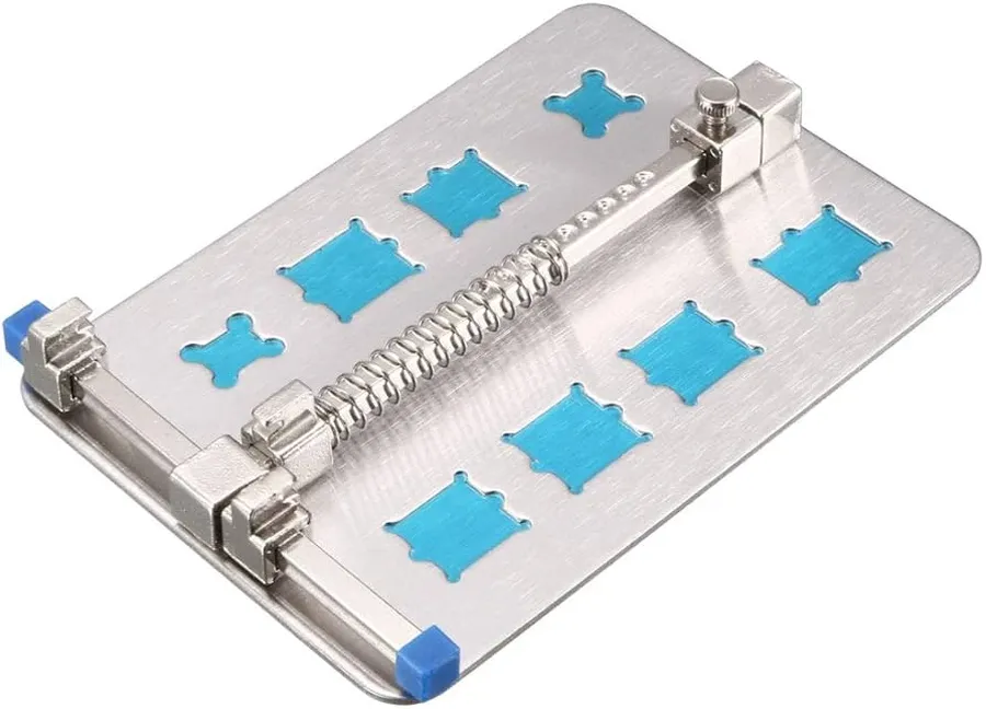 A mobile phone PCB held securely in a stand.