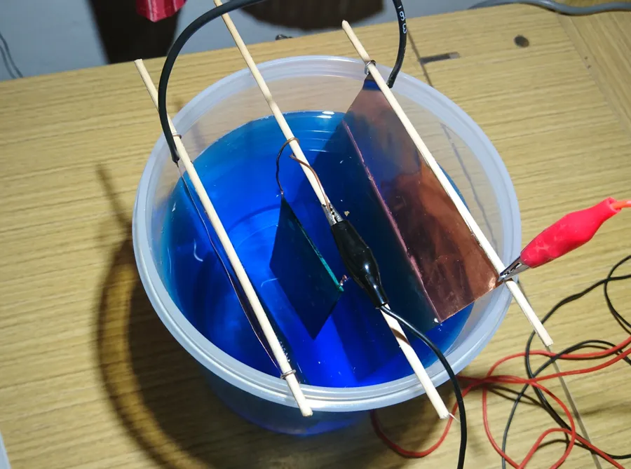 A close-up of the electroplating process of a PCB.