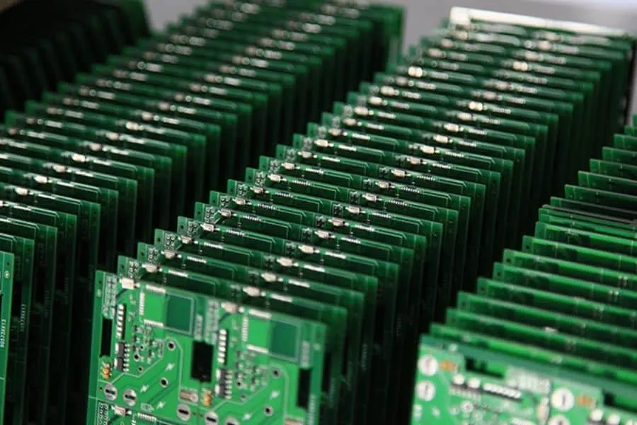 A large quantity of PCBs being produced in a manufacturing facility.