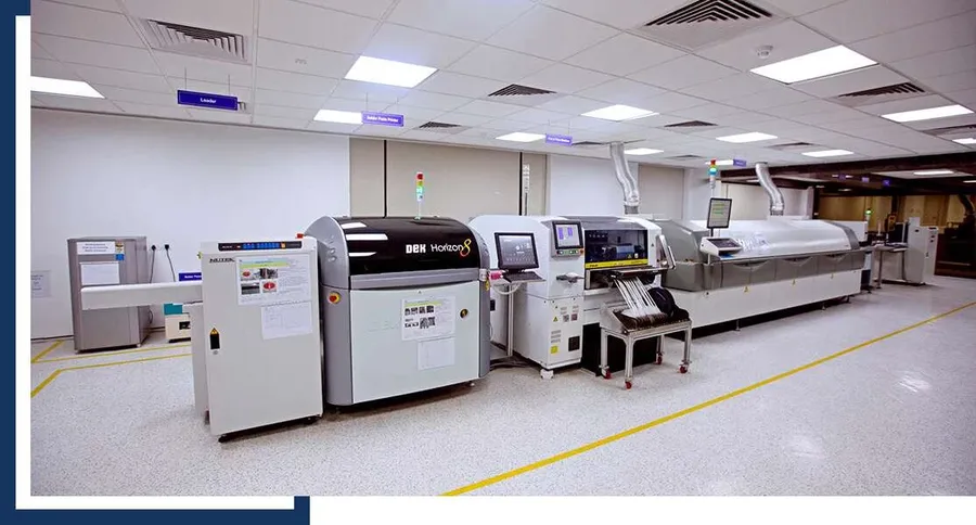 A PCB undergoing surface mount technology assembly on an SMT line.