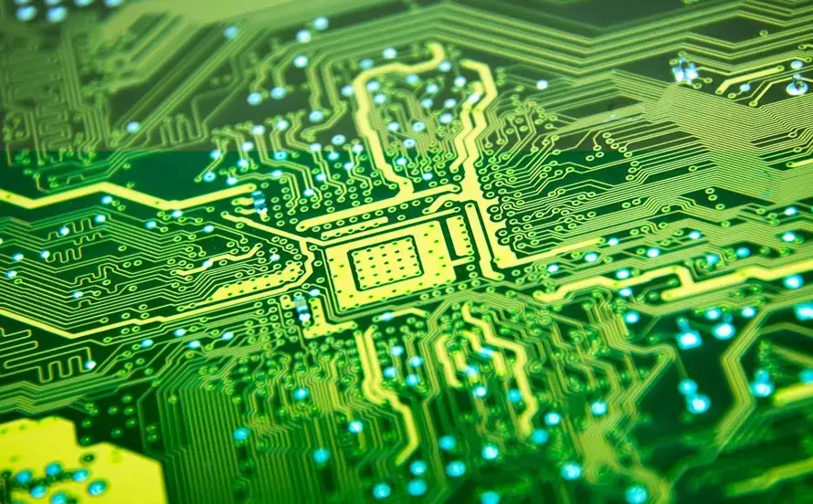 A stack of bare PCBs ready for assembly.