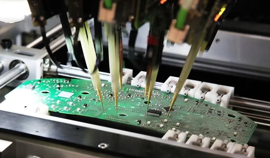 A piece of equipment testing a assembled PCB board.