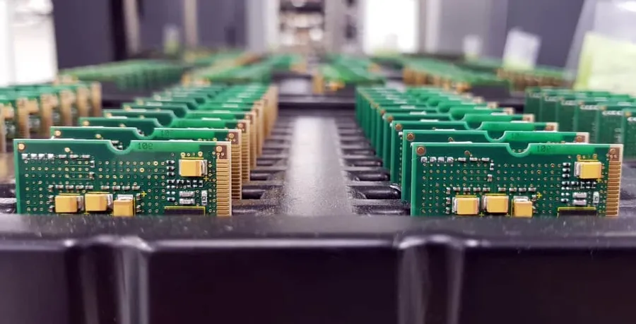 A close-up of a printed circuit board during the manufacturing process.