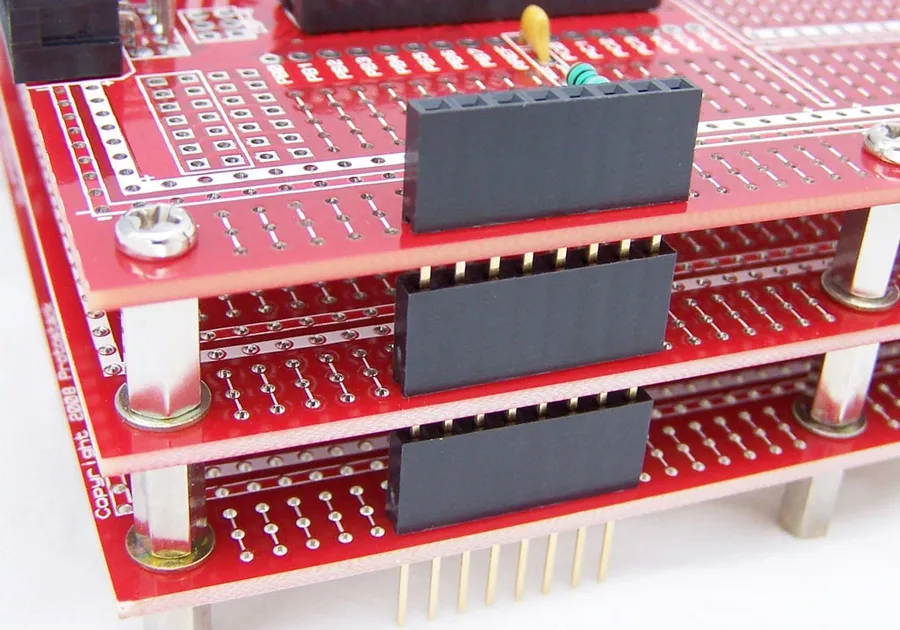 A stack of printed circuit boards ready for production.