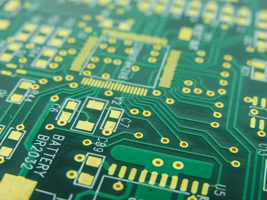 A stack of newly manufactured PCBs.