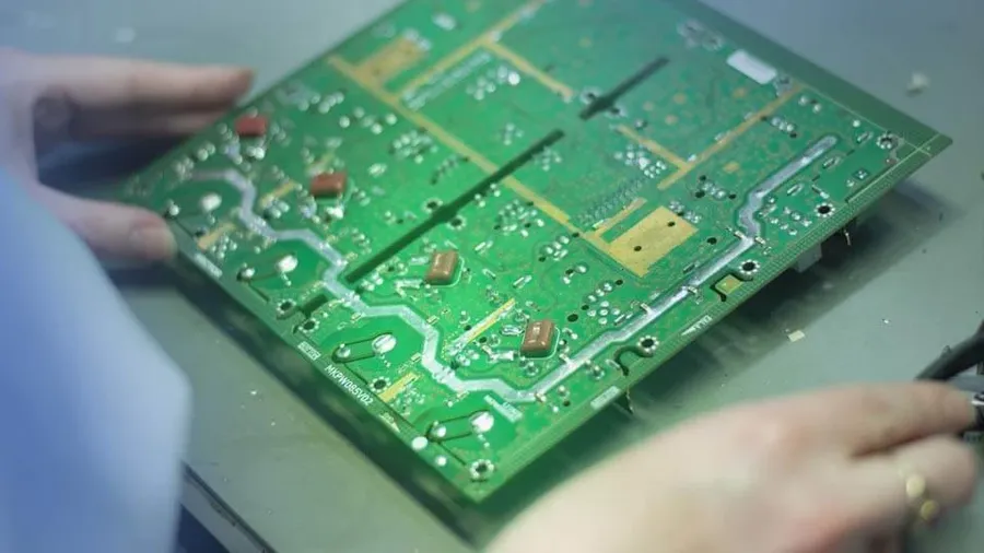 A cross-sectional view of a PCB showing embedded components inside.