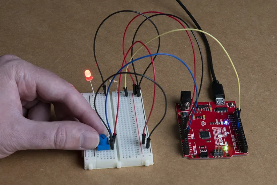 A potentiometer connected on a breadboard.