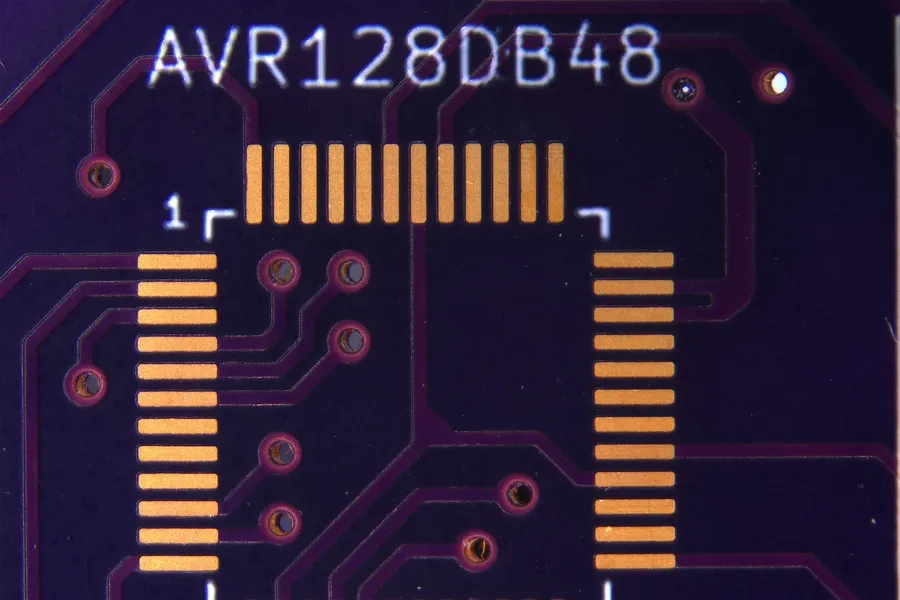 A person holding a PCB and speaking to a vendor or a customer.