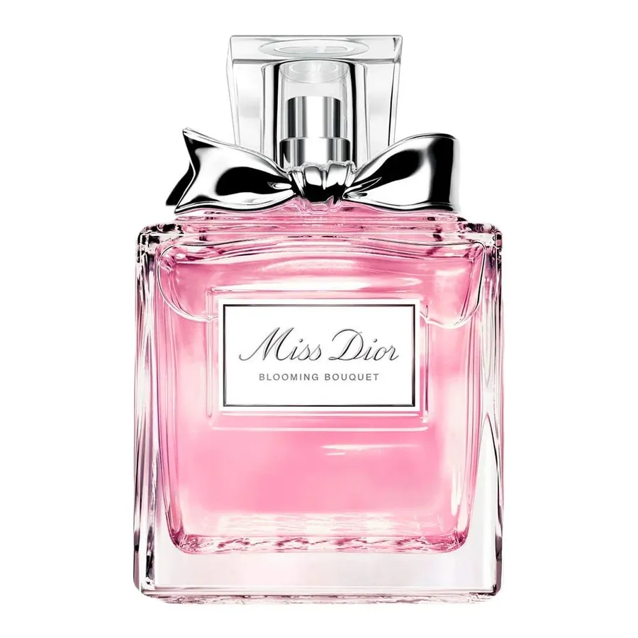 A bottle of Miss Dior Blooming Bouquet with flowers in the background.