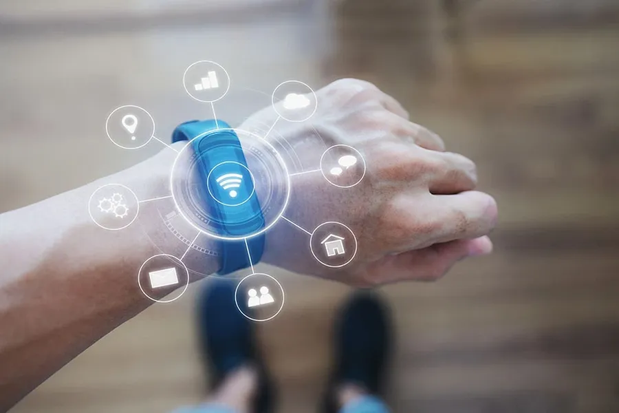 A person wearing a smartwatch on their wrist.
