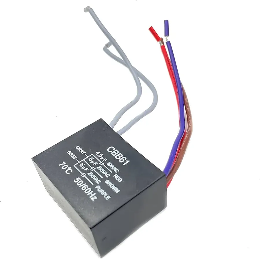 A cylindrical fan capacitor with wires attached.