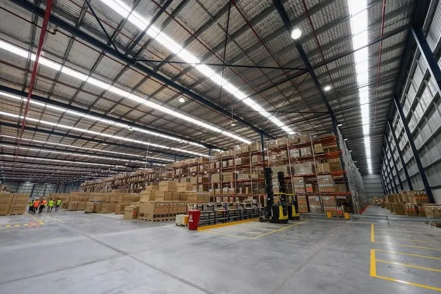 Shelves of electronic components in a large warehouse.