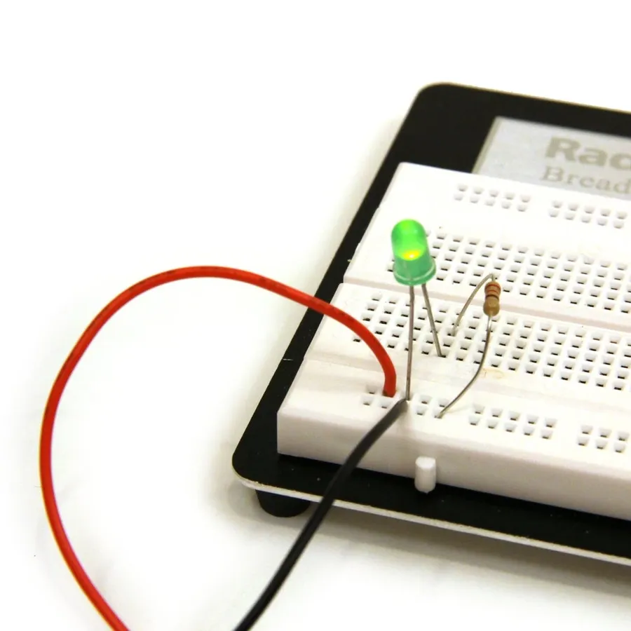 A breadboard showing several resistors connected in a series circuit.