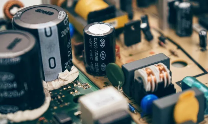 Several capacitors soldered onto a printed circuit board.