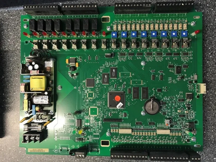 A damaged air conditioner PCB showing signs of burnt components.