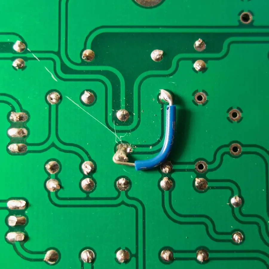 A close-up of repaired PCB pads