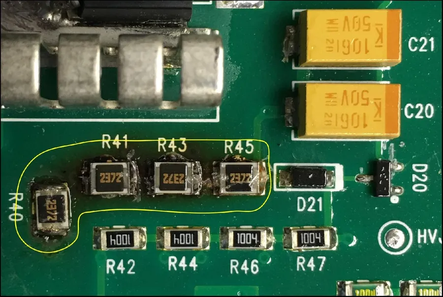 A close up of a resistor that is visibly overheated.