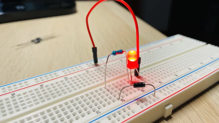 A 1N4007 diode mounted on a breadboard in a test setup.