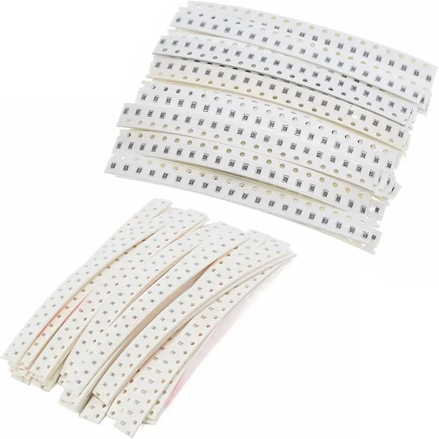 Various SMD resistors and capacitors arranged on a surface.