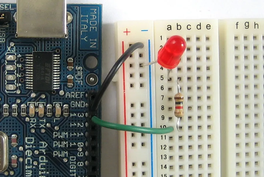 An LED circuit assembled on a breadboard with a resistor.
