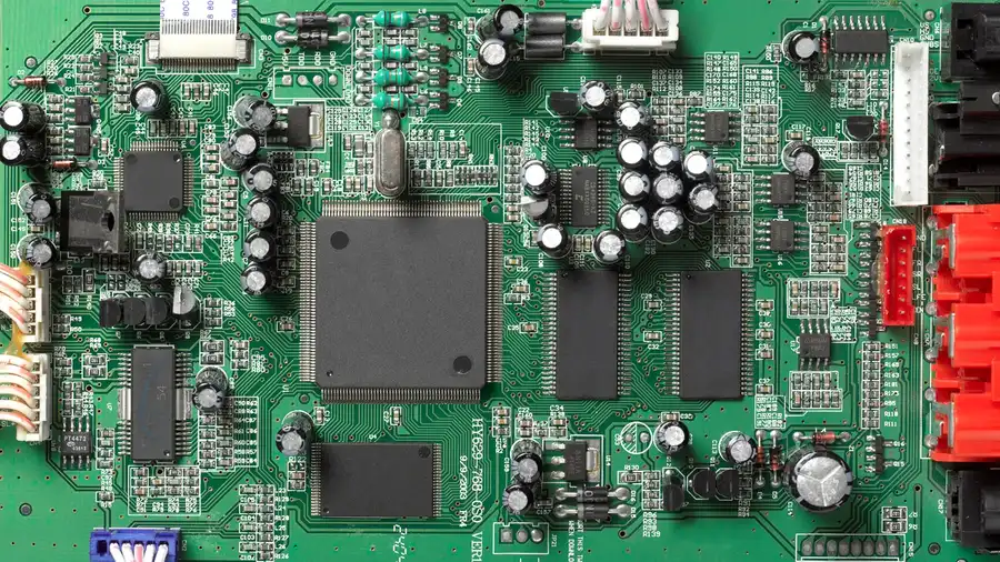 Close-up view of capacitors inside an electrical appliance.