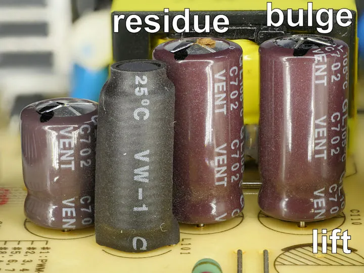 A close up image of a damaged or bulging capacitor.