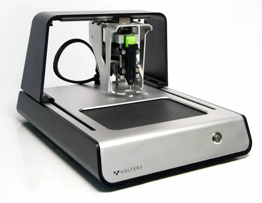 A desktop PCB printer in operation.