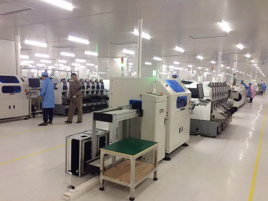An SMT production line with machines assembling PCBs