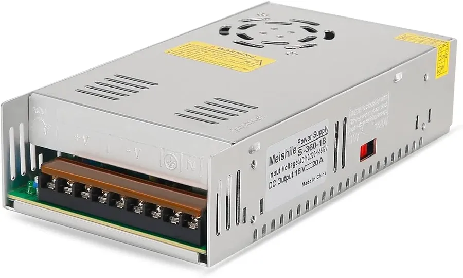 An industrial power supply unit with its various terminals and control interface.