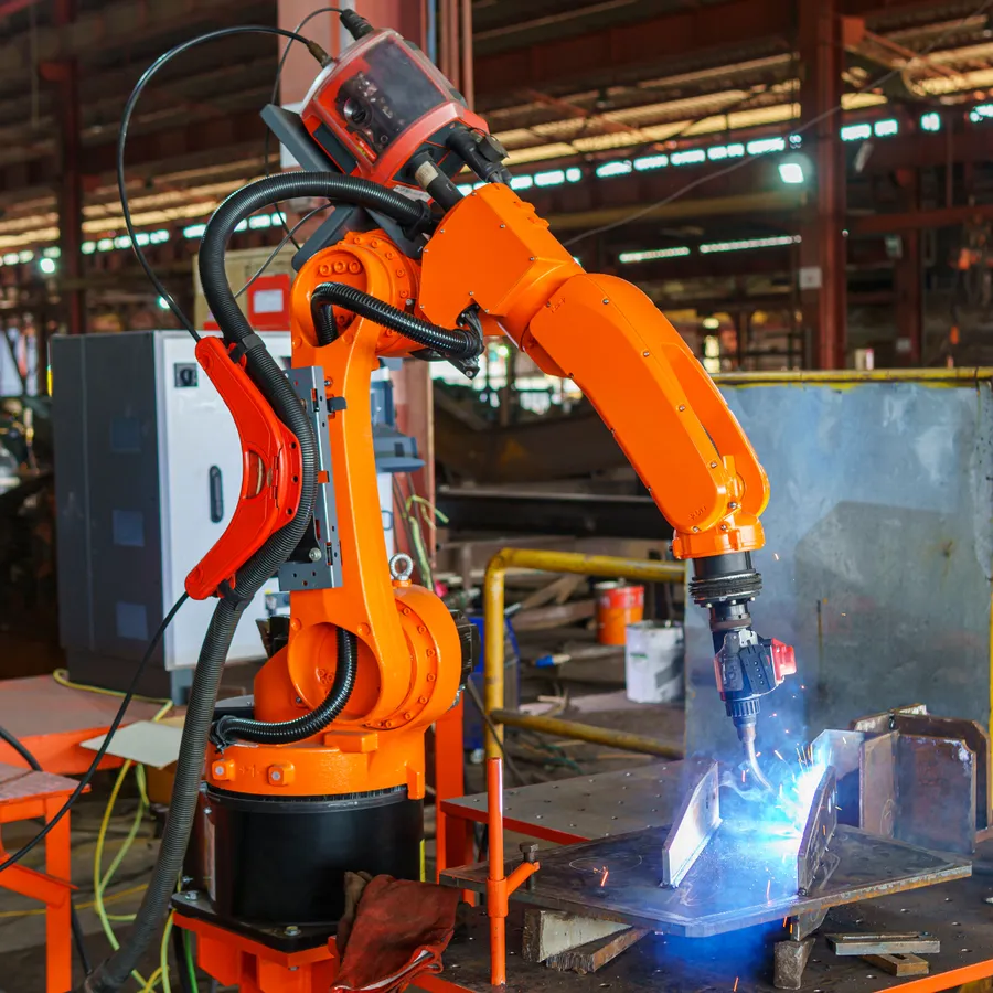 A robotic arm performing an assembly task in a manufacturing facility.