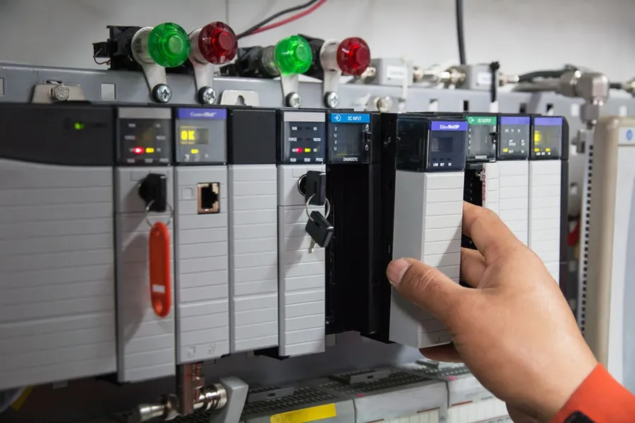 A programmable logic controller unit with its modules and wiring.
