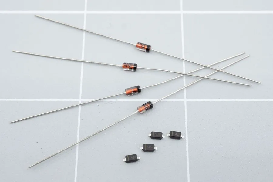 Side-by-side comparison of an SMD diode and a through-hole diode.