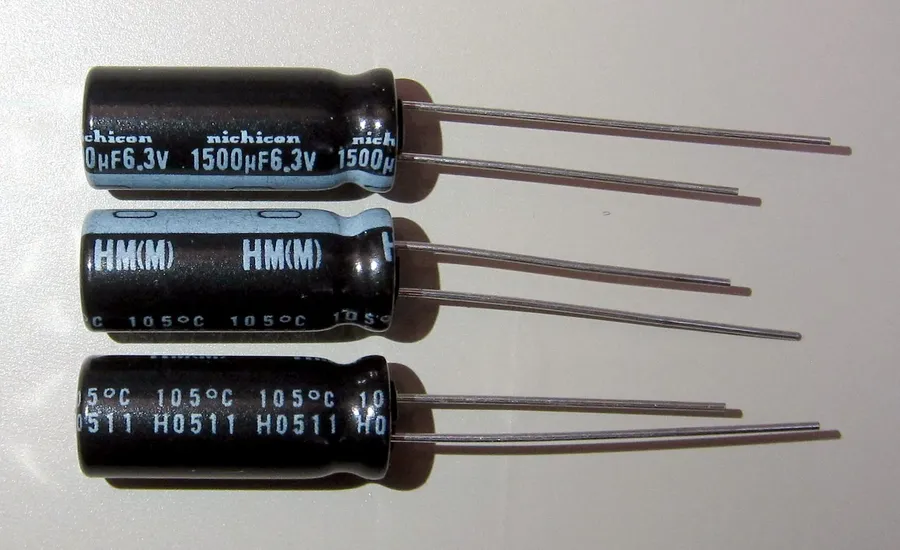 A damaged polarized capacitor showing signs of failure due to incorrect polarity.