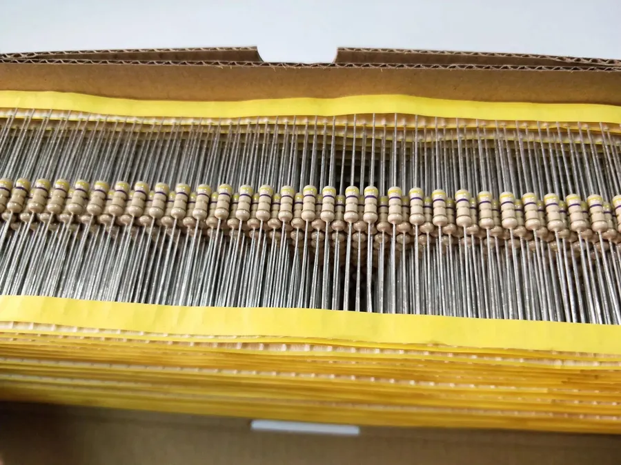 A detailed close-up view of a fixed resistor with color bands.