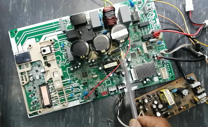 A close-up of an air conditioner PCB board.