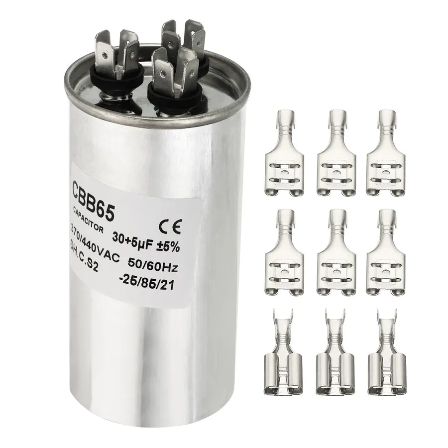 A CBB65 capacitor being installed in a motor.