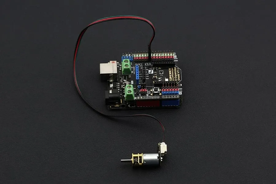 An Arduino Micro controlling a small DC motor using a driver.