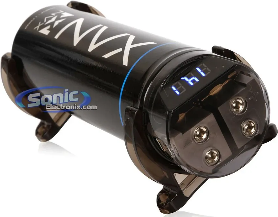 A car audio capacitor being installed in a vehicle trunk.
